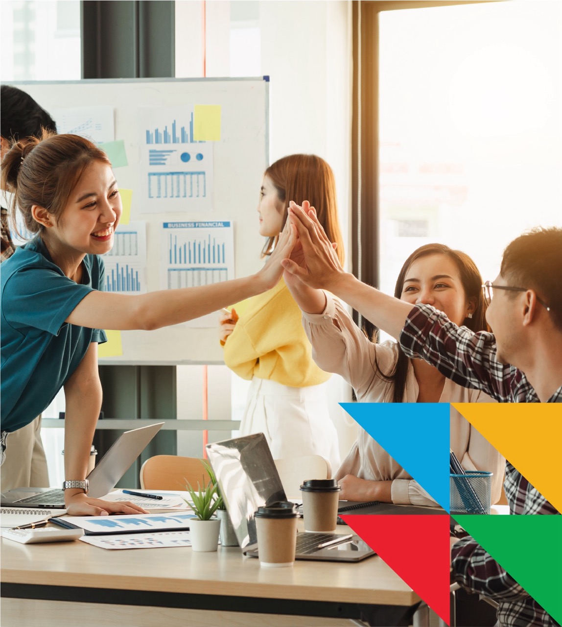 Students high-fiving in classroom